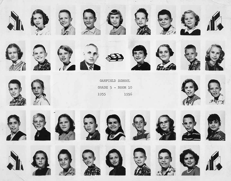 Black and white photograph taken during the 1955 to 1956 school year. Pictured is the fifth grade classroom in room ten. 34 children and one adult are pictured. 